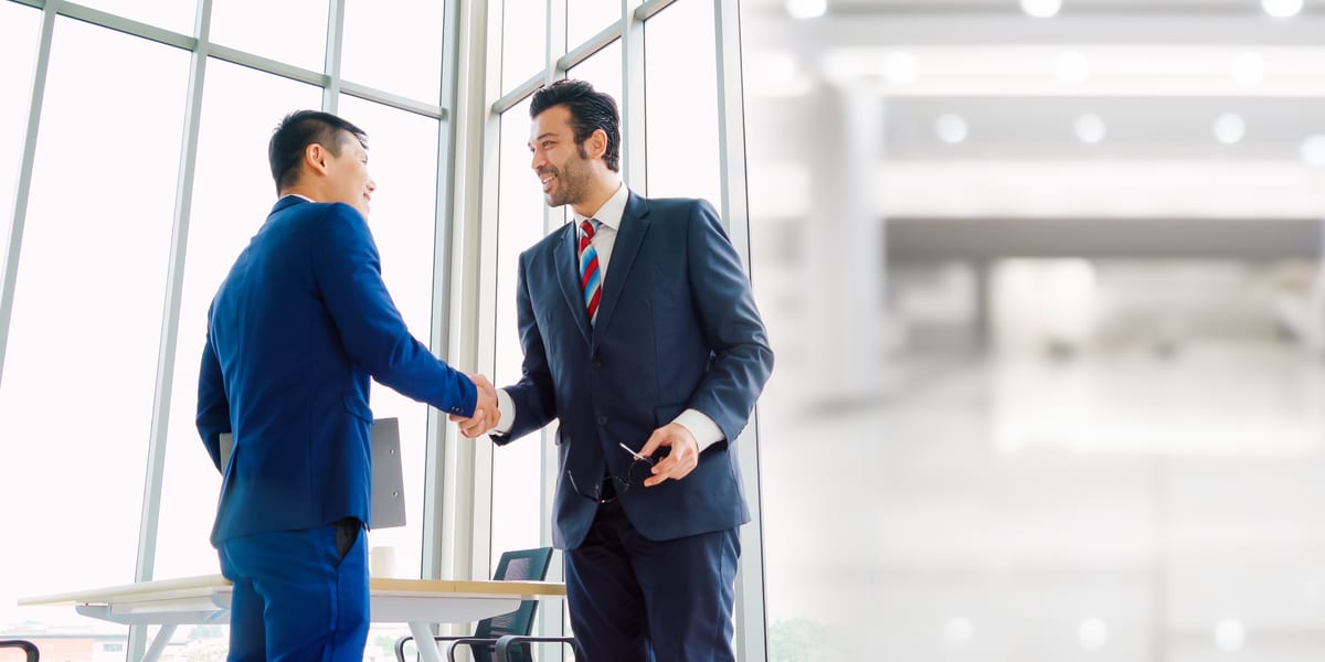 Two businessmen shaking hands