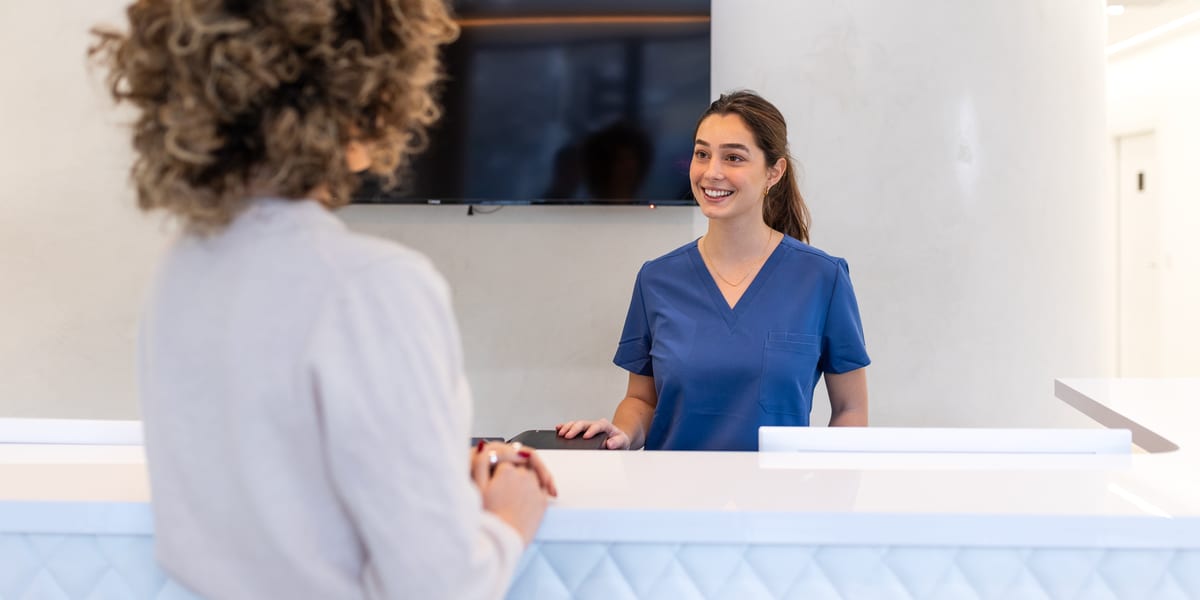 Doctor at the front desk of a dermatology practice